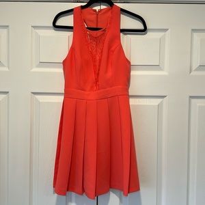 BCBGeneration orange flowy mini dress with lace cutouts